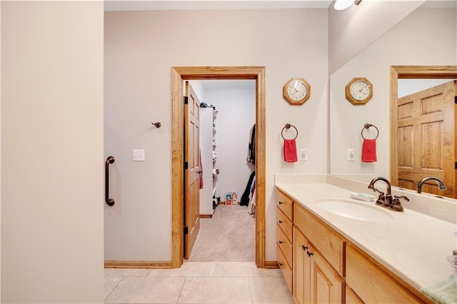 bathroom with tile patterned flooring and vanity