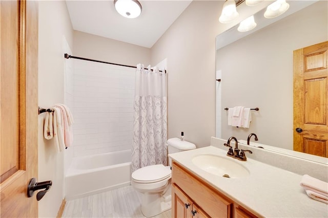 full bathroom with shower / bath combo, toilet, and vanity