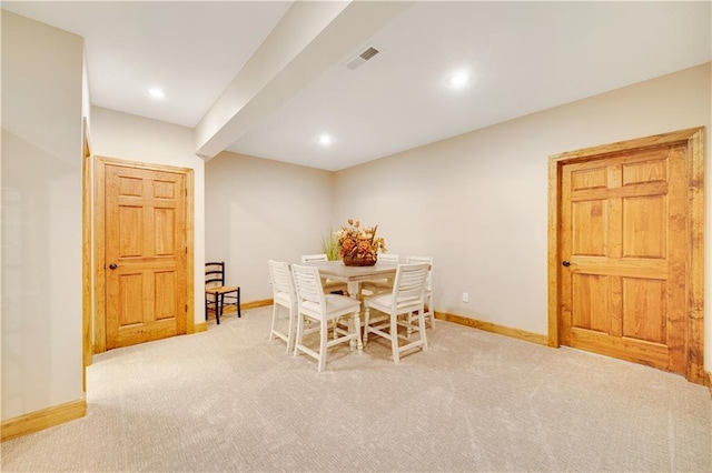 dining area with light carpet