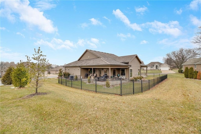 back of property featuring a yard and a patio