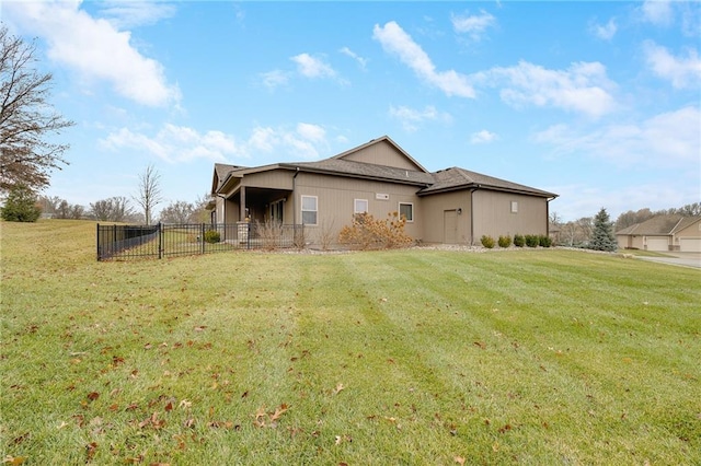 rear view of house with a lawn