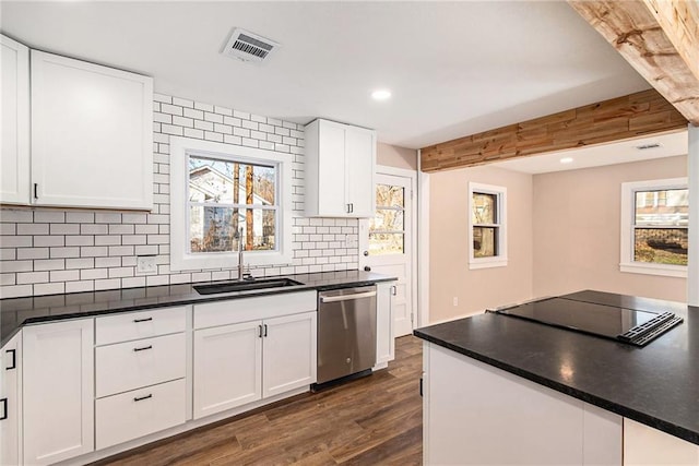 kitchen with visible vents, a sink, dark countertops, dishwasher, and dark wood-style flooring