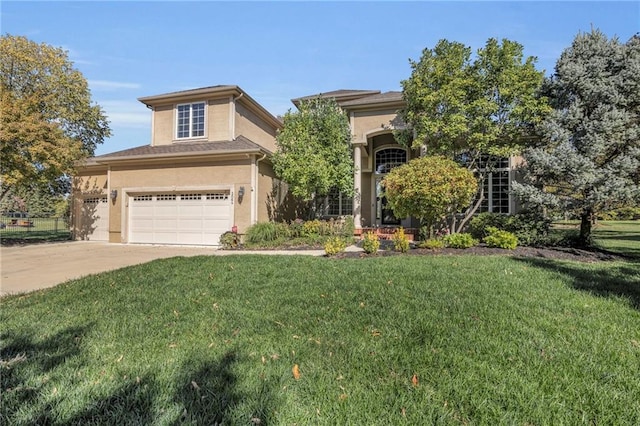 view of front of property featuring a garage and a front yard