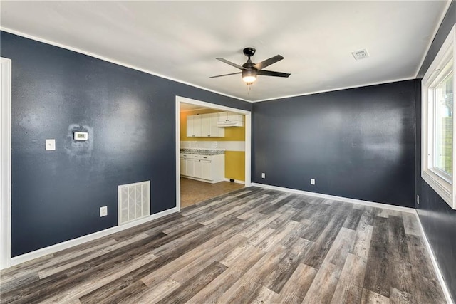 interior space with dark hardwood / wood-style floors and ceiling fan