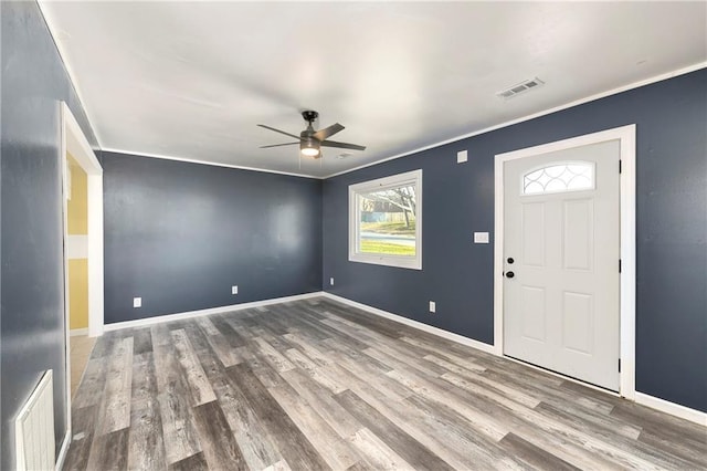 foyer entrance featuring ceiling fan, wood-type flooring, and ornamental molding