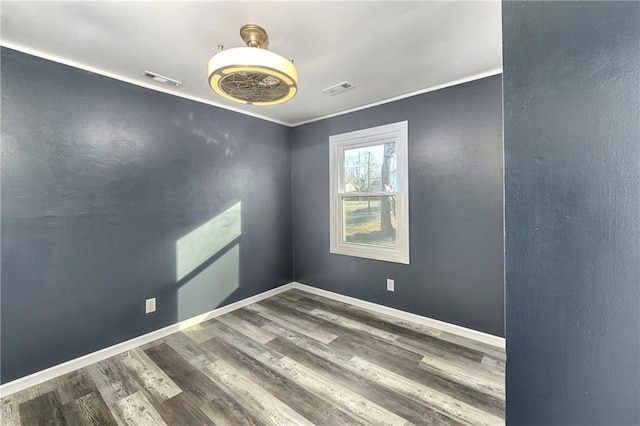 empty room with hardwood / wood-style flooring