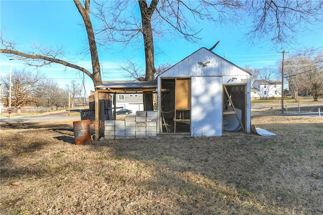 view of outbuilding with a yard