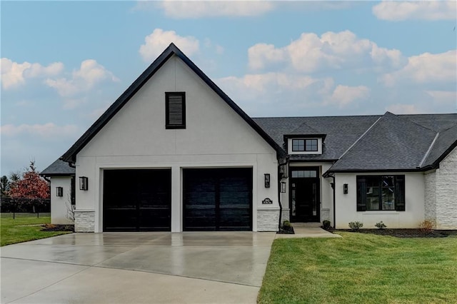 modern inspired farmhouse featuring a front yard and a garage