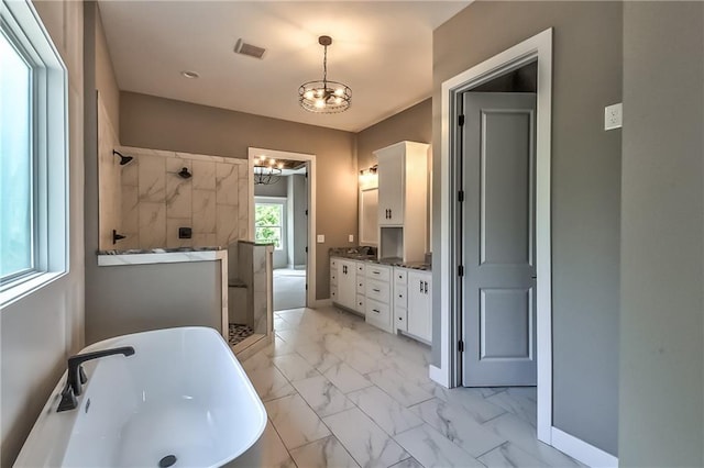 bathroom with independent shower and bath, vanity, and a chandelier