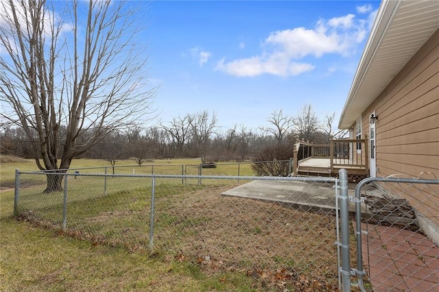 view of yard featuring a rural view and a deck