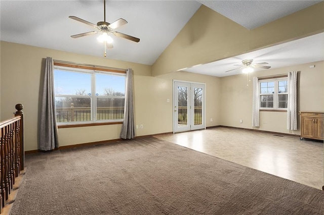 unfurnished living room with carpet floors, high vaulted ceiling, and ceiling fan