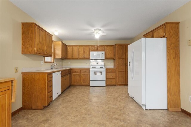 kitchen featuring sink and white appliances