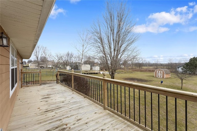 deck with a storage unit and a yard