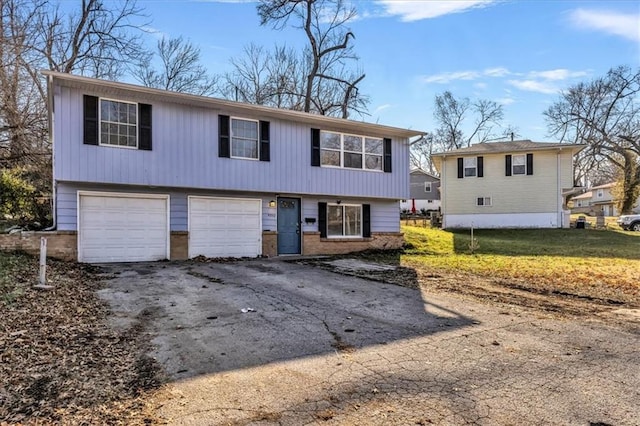 bi-level home featuring a garage