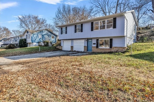 view of front of property featuring a garage and a front lawn