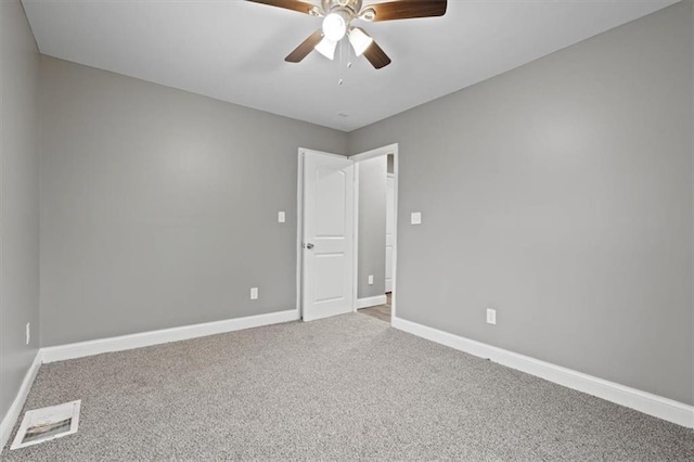 carpeted empty room with ceiling fan