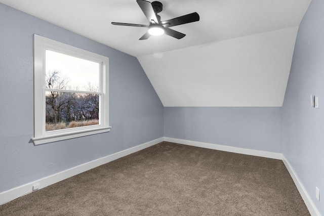 additional living space featuring carpet, ceiling fan, and lofted ceiling