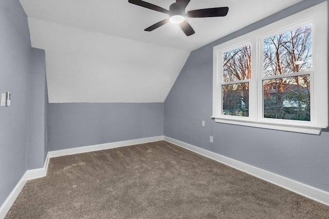 additional living space featuring carpet flooring, ceiling fan, and vaulted ceiling