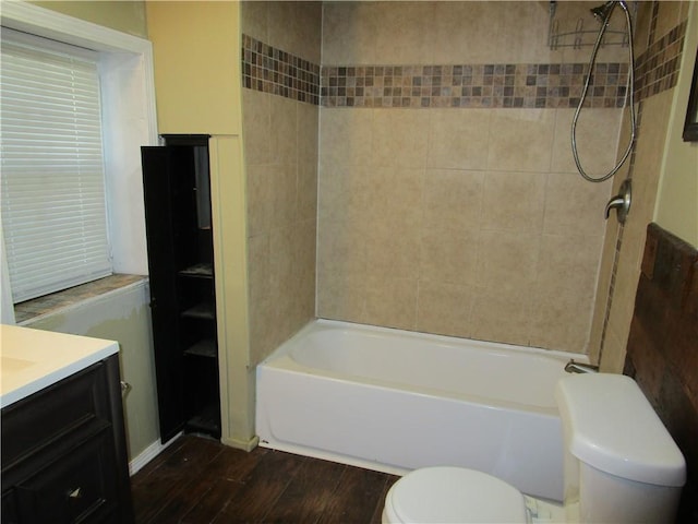 full bathroom with toilet, shower / bathing tub combination, vanity, and wood finished floors