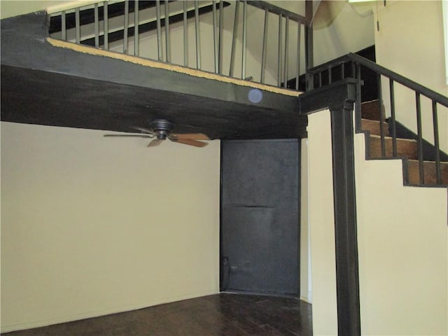interior space with ceiling fan