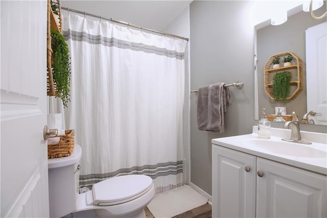 full bath featuring curtained shower, vanity, and toilet