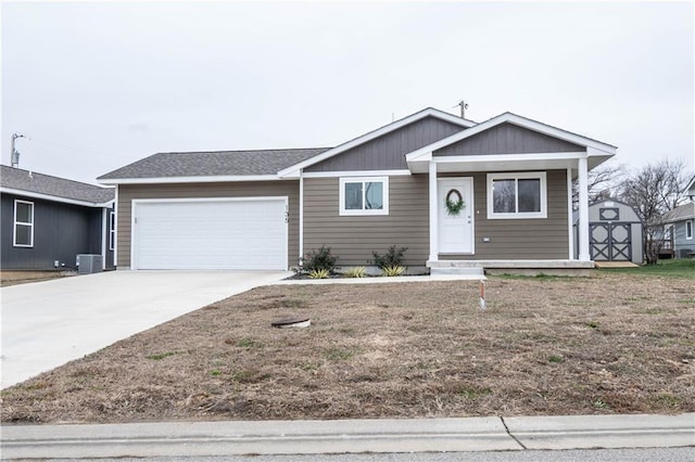 view of front of house with central AC and a garage