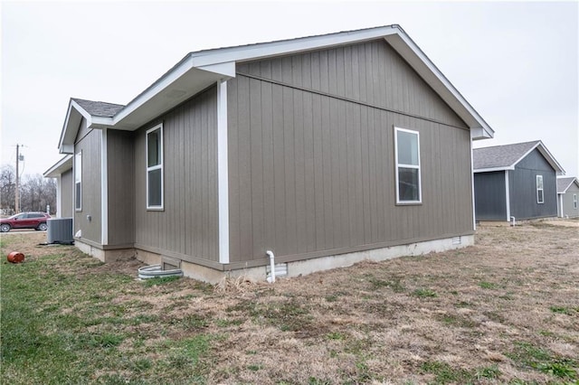 view of side of property with central AC unit