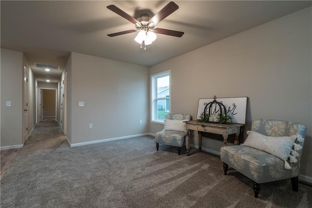 sitting room with carpet flooring and ceiling fan