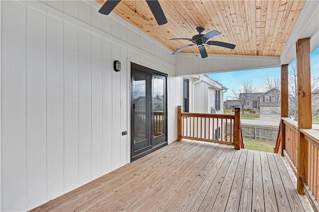 wooden deck featuring ceiling fan