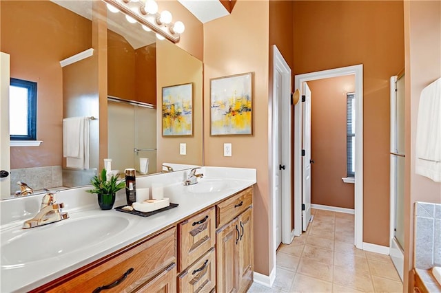 bathroom featuring vanity, tile patterned floors, and independent shower and bath