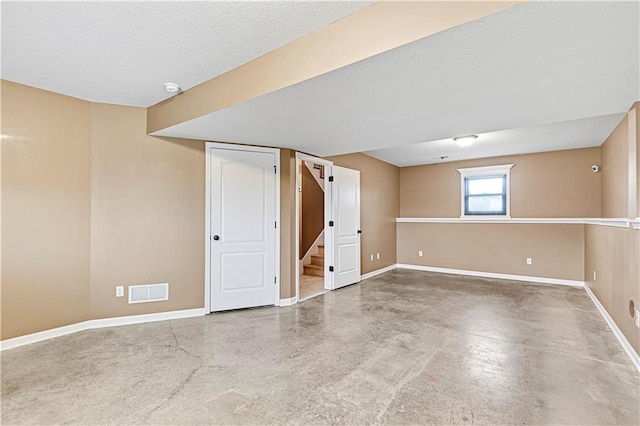 basement with a textured ceiling