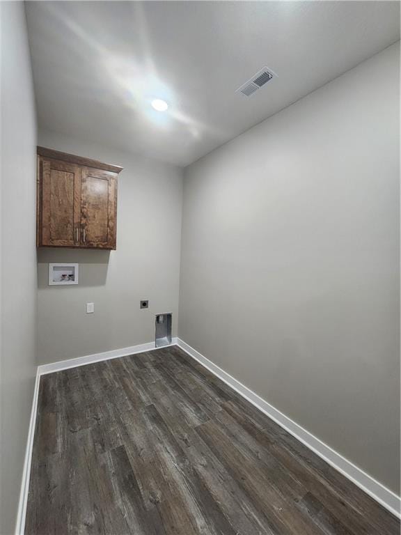 laundry area with washer hookup, dark hardwood / wood-style flooring, cabinets, and hookup for an electric dryer