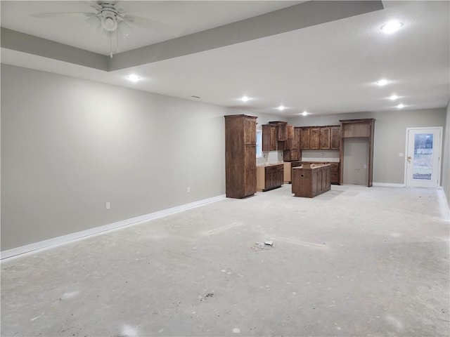 unfurnished living room featuring ceiling fan