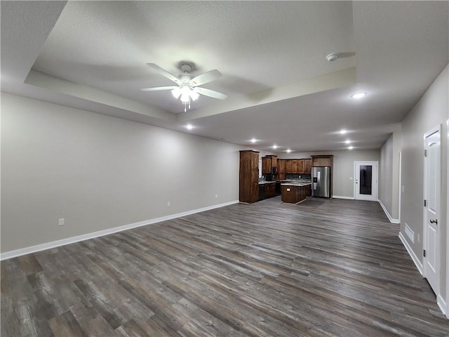 unfurnished living room featuring recessed lighting, baseboards, a ceiling fan, and dark wood-style floors