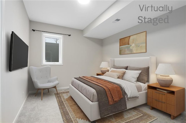 bedroom featuring visible vents, baseboards, and light colored carpet