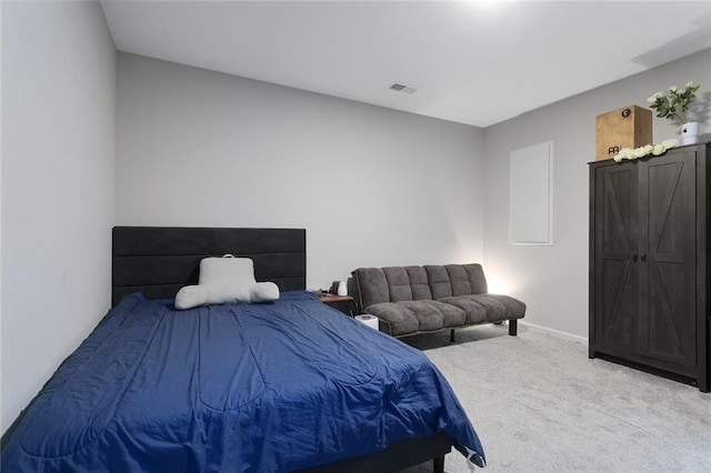 bedroom with visible vents, baseboards, and carpet