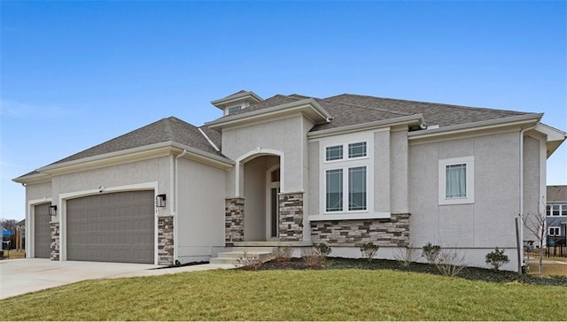 view of front facade with a front lawn, stucco siding, driveway, stone siding, and an attached garage