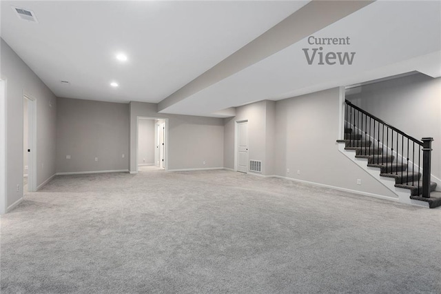 basement featuring stairs, recessed lighting, baseboards, and carpet floors