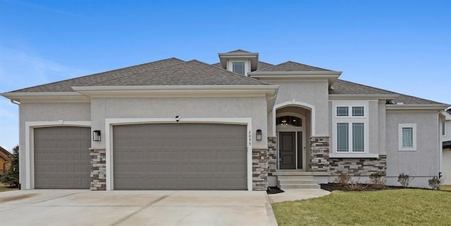 view of front of home with a garage, stucco siding, concrete driveway, and stone siding