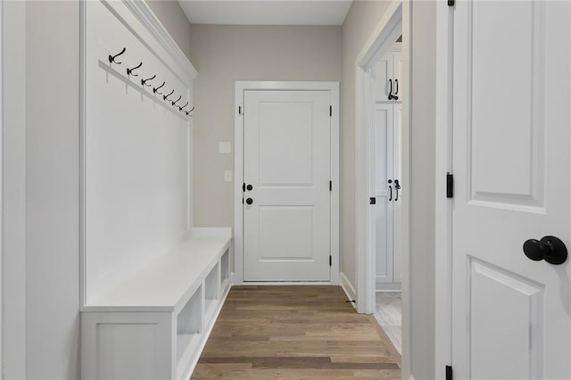 mudroom with light wood-style flooring