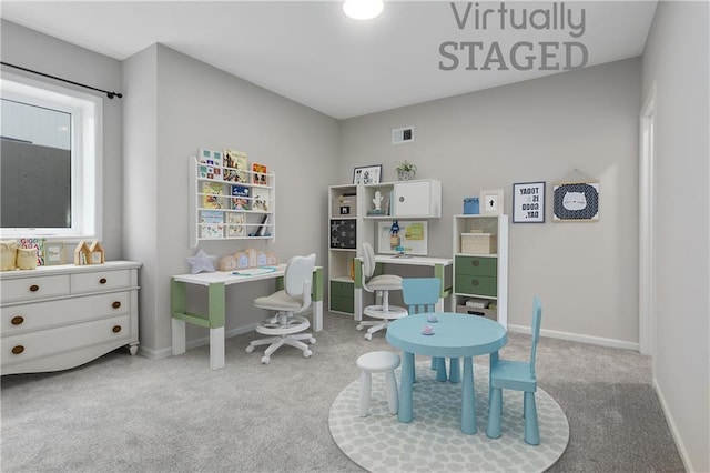 rec room featuring baseboards, visible vents, and carpet flooring