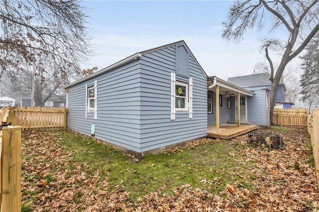 rear view of house with a lawn