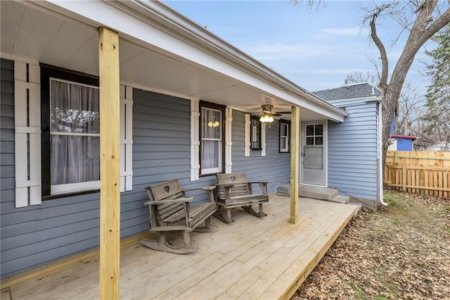 wooden terrace featuring ceiling fan and covered porch