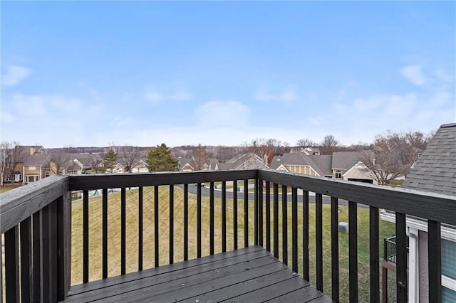 wooden terrace with a lawn