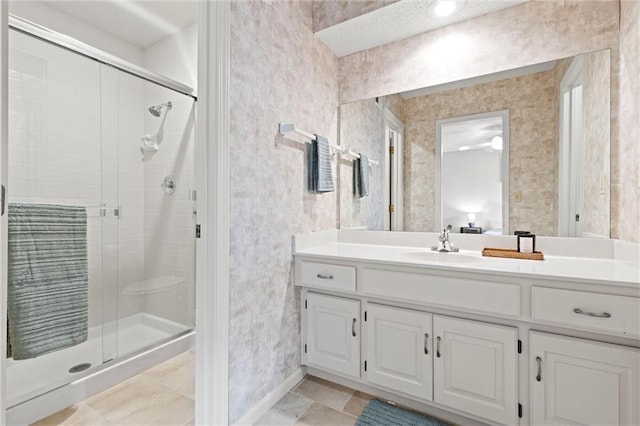 bathroom with vanity and a shower with shower door