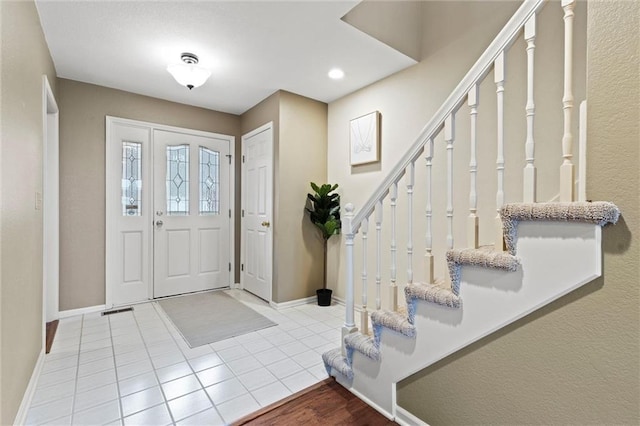 view of tiled foyer entrance