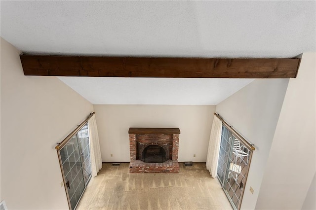 living room with light colored carpet, a fireplace, and beam ceiling