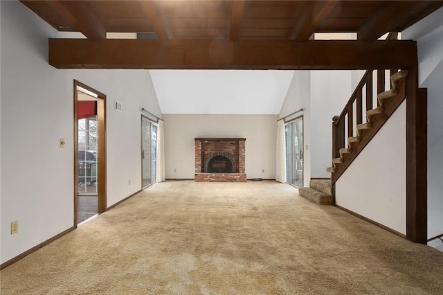 unfurnished living room featuring a brick fireplace, light colored carpet, and vaulted ceiling with beams