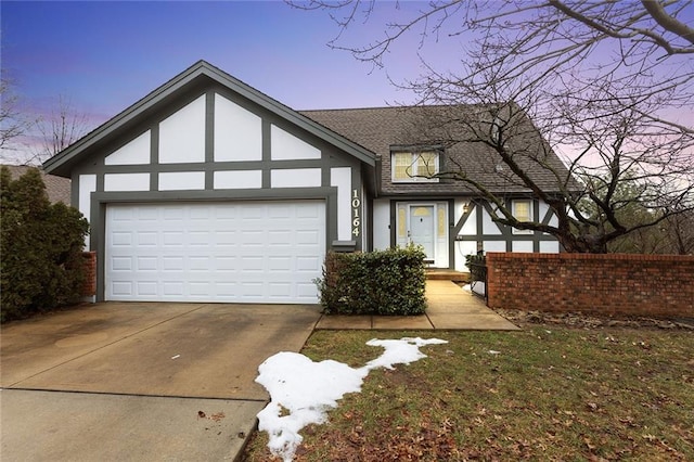 tudor-style house with a garage