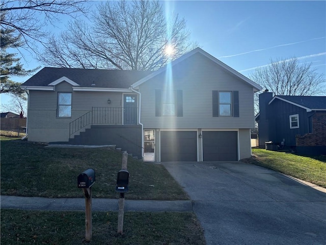 view of front of home featuring a garage and a front lawn